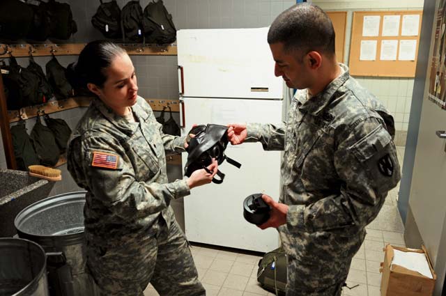  Romero disassembles an M40/A1 protective mask with Staff Sgt. Jose Espinoza, a platoon sergeant and armorer also with HHC, Feb. 26 on Daenner Kaserne.