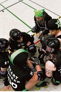 Members of the Roller Girls of the Apocalypse roller derby team talk to each other about different strategies during a bout March 9 in Kaiserslautern. The team, originally the K-Town Derby Girls, is a nonprofit sports club for anyone looking for a little recreation.
