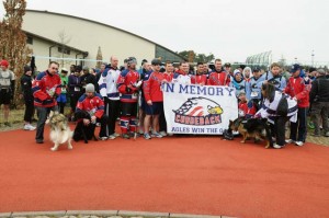 Photos by Airman 1st Class Holly Cook Members of the KMC Eagles hockey team pose for a group photo before the start of the second annual Airman 1st Class Zachary Ryan Cuddeback Memorial 5K March 2 on Ramstein.