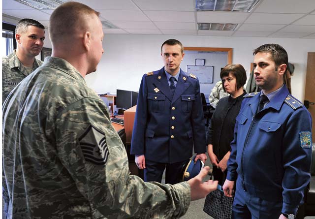 Master Sgt. Etienne P. Tousignant, 86th Force Support Squadron First Term Airmen Course instructor, briefs visitors from the Ukrainian military on the importance of introducing new Airmen to the Air Force and the base March 5 on Ramstein.