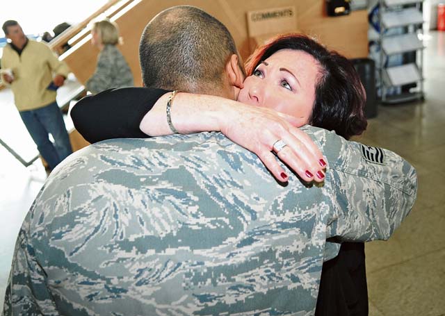 Christina M. Wall, a logistics management specialist with the 21st Theater Sustainment Command, hugs her son, Air Force Tech Sgt. Steven C. Wall, a fuel systems craftsman assigned to 55th Maintenance Squadron, during his layover at Ramstein March 6. Steven is deploying to the Central Command theater of operations from Offutt Air Force Base, Neb., and enjoyed the chance to see his mother for the first time in two years.