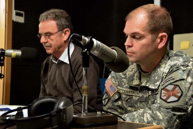 Lt. Col. Lars Zetterstrom (right), U.S. Army Garrison Kaiserslautern commander, and Paul Lindemer, a public works employee, talk on American Forces Network radio. On Wednesday, Zetterstrom will hold a “Commander’s Corner” — a hybrid radio and Internet-based event.