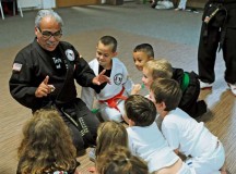 Karate Tech class instructor Richard Vasquez quizzes students to evaluate their knowledge of martial arts Oct. 8 on Vogelweh. The Karate Tech class is offered to KMC members of all ages to learn self-defense. The instructor trains students not only to compete in martial arts competitions, but to strengthen the body and soul. Using techniques created more than 1,400 years ago, students learn to improve self-
discipline and to defend themselves if needed. Class instructors provide instructions on using a variety of techniques from several martial art disciplines. Classes are held at the Vogelweh and Ramstein community centers for students with all levels of karate experience.