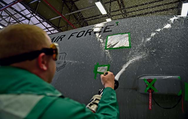 Staff Sgt. Nathan Baker, 86th Aircraft Maintenance Squadron aircraft hydraulics craftsman, washes the nose of a C-130J Super Hercules.