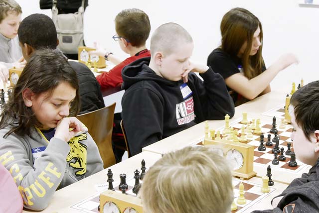 American students play chess in local championship