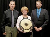 Three U.S. Army Garrison Rheinland-Pfalz Directorate of Family, Morale, Welfare and Recreation employees, (from left) Steve Selvey, Kaiserslautern Outdoor Recreation director; Ingrid Osewalt, Kaiserslautern DFMWR deputy director and Beau Yeager, Baumholder Outdoor Recreation director; accept the award for being a finalist in the Armed Forces category in the 2019 National Recreation and Park Association National Gold Medal Award program in Baltimore, Maryland, in September.