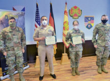 U.S. Army Garrison Rheinland-Pfalz Commander Col. Jason Edwards (left) and Command Sgt. Maj. Brett Waterhouse (right) present awards to Chief Hospital Corpsman Armando Montoya, Naval Medical Logistics Command Detachment, U.S. Army Medical Materiel Center, and Army Sgt. Kayla Winslow, U.S. Army Europe Band and Chorus, first place winners of the Better Opportunities for Single Service Members 100-Mile Challenge. The challenge inspired single service members to get on their feet and stay moving by running 100 miles during the month of May. Photos by Keith Pannell
