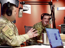 U.S. Air Force Brig. Gen. Mark R. August, 86th Airlift Wing commander, right, and Chief Master Sgt. Ernesto J. Rendon, 86th AW command chief, discuss their time spent as the 86th AW command team at the American Forces Network Kaiserslautern radio station at Vogelweh Military Complex, July 24. Before parting ways with the 86th AW, August and Rendon shared their proudest accomplishments and answered questions about what they valued most during their assignment.