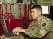 U.S. Air Force Tech. Sgt. Christopher Kim, 86th Aircraft Maintenance Squadron C-130 hydraulic systems craftsman and hydraulics noncommissioned officer in charge, looks up a maintenance task on a C-130J Super Hercules aircraft at Ramstein Air Base, July 8. Kim was recently handpicked to fill the hydraulic section’s NCOIC position.