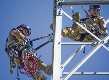 U.S. Air Force Senior Airman Brandon Allen, left, and Senior Airman Alex Baldomino, 1st Communications Maintenance Squadron cable and antenna theater maintenance technicians, conduct tower rescue training at Kapaun Air Station, July 21. The 1st CMXS hosts the tower training on a quarterly basis to ensure Airmen are certified to fulfill mission requirements in both their home stations and deployed assignments.
