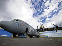 U.S. Airmen assigned to the 37th Airlift Squadron conduct a tour of a C-130J Super Hercules for 424th Air Base Squadron Emergency Response Flight Airmen at Chièvres Air Base, Belgium, July 27. The firefighters were shown access points on the roof of the aircraft so they could find alternative means of navigating the plane in the event of an emergency.