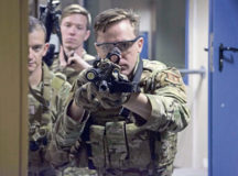 U.S. Air Force Staff Sgt. Lance Munsee, 435th Security Forces Squadron contingency response team member, clears a corner during close quarters battle training at Ramstein Air Base, July 28. The Airmen honed skills that could be used to clear a house or hangar that may be occupied by an enemy force.