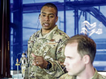 U.S. Air Force Master Sgt. Bruce Black, 86th Operations Support Squadron tower assistant chief controller, coordinates with another controller at Ramstein Air Base, Germany, Aug. 24, 2020. Black was the OSS lead for Operation Infinity, Brig. Gen. Mark R. August’s fini-flight. (U.S. Air Force photo by Senior Airman Noah D. Coger)