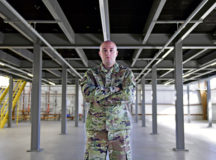 U.S. Air Force Staff Sgt. Zachary R. Tingen, 86th Maintenance Squadron programs manager, poses for a photo at a multi-use maintenance facility, one of four construction projects he has overseen at Ramstein Air Base, Germany, Sept. 9, 2020. Tingen’s facility construction project efforts resulted in the fusion of three flights into a 56,000 square foot hangar, increasing C-130J Super Hercules aircraft letter check manpower by 65%. (U.S. Air Force photo by Airman 1st Class John R. Wright)