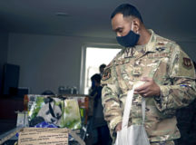 U.S. Air Force Staff Sgt. Shranil Kumar, 86th Civil Engineer Squadron Airmen Dorm Leader, puts an assortment of snacks into a welcome bag for incoming junior Airmen who will be required to self-quarantine on Ramstein Air Base, Germany, Oct. 8, 2020. Kumar and 12 others volunteered to put welcome bags together to make the transition to Germany a little easier for incoming Airmen who have to quarantine upon arrival. (U.S. Air Force photo by Senior Airman Kristof J. Rixmann)
