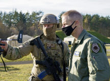 U.S. Air Force Tech. Sgt. Cameron Piontek, 435th Contingency Response Squadron contingency air traffic controller, left, shows Maj. Gen. Derek France, Headquarters U.S. Air Forces in Europe-Air Forces Africa strategic deterrence and nuclear integration operations director, a joint-terminal attack controller wind meter during exercise Agile Wolf 21-01 at Grafenwoehr Training Area, Germany, Nov. 18, 2020. France toured the 435th CRG’s expeditionary site to meet Airmen and gain insight on their objectives and capabilities. Agile Wolf 21-01 was designed to sharpen the 435th Contingency Response Group’s tactics, techniques and procedures for establishing expeditionary airfields on demand. (U.S. Air Force photo by Senior Airman Milton Hamilton)