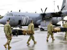 U.S. Air Force Airmen assigned to the 86th Aeromedical Evacuation Squadron carry medical equipment to a C-130J Super Hercules at Ramstein Air Base, Germany, Dec. 15, 2020. The 86th AES held a COVID-19 patient movement training using the Negatively Pressurized Conex-Lite. (U.S. Air Force photo by Senior Airman John R. Wright)