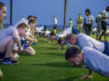 Officer Training School trainees perform push-ups during an official Air Force Physical Training test, Aug. 8, 2019, Maxwell Air Force Base, Alabama. The Air Force PT test is comprised of four components: aerobic, body composition, push-ups and sit-ups. (U.S. Air Force photo by Airman 1st Class Charles Welty)