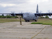 U.S. Air Force Staff Sgt. Alex Smelcer, 86th Aircraft Maintenance Squadron flight crew chief, marshals a C-130J Super Hercules aircraft onto the flightline during exercise Agile Spirit 21 at Alekseevka Air Base, Georgia, July 26, 2021. Smelcer played several roles during the exercise which included inspecting, fixing and preparing all U.S. Air Force air assets before and after the flight. Agile Spirit 2021 is a joint, multinational exercise co-led by the Georgian Defense Forces and U.S. Army Europe and Africa. (U.S. Air Force photo by Senior Airman Milton Hamilton)