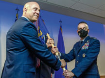 U.S. Air Force Col. William Wallis, right, 65thth Air Base Group incoming commander, assumes command of the 65th ABG from U.S. Air Force Brig. Gen. Josh Olson, left, 86th Airlift Wing commander, at Lajes Field, Azores, July 27, 2021. The 65th ABG plays a vital role in combat operations enabling the movement of military members and aircraft supporting joint, coalition and NATO operations as part of U.S. and Allied Air Expeditionary Forces. (U.S. Air Force photo by Staff Sgt. Megan Munoz)