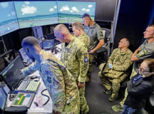 U.S. Air Force Staff Sgt. Jalah Patten, 86th Operations Support Squadron air traffic control tower watch supervisor, left, shows members of the Ukrainian armed forces a tower simulator system during their visit to Ramstein Air Base, Germany, Aug. 5, 2021. The system allows ATC Airmen to train on airspace and airfield navigation and management on multiple simulated U.S. Air Force bases. The Ukrainian service members were able to review fundamental concepts to potentially enable them to host a variety of U.S. Air Force and NATO aircraft at their installations. (U.S. Air Force photo by Senior Airman John R. Wright)