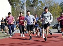 Members of the 86th Security Forces Squadron begin an 800-meter run during a fitness combine as part of the Project PHNX program at Ramstein Air Base, Germany, April 20, 2022. The combine consisted of six exercises and was performed three months apart to measure improvement over the course of three months. Project PHNX, short for pairing health, nutrition and exercise, brings medical specialists, chaplains, military family life consultants and more to squadrons and focuses on preventative care instead of reactive care.