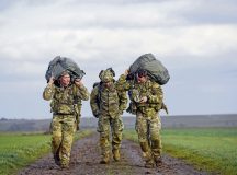 U.S. Army paratroopers from the 173rd Airborne Brigade and the 1st Battalion, 10th Special Forces Group, carry their gear after a jump into Alzey Drop Zone in Ober-Flörsheim, Germany, Jan. 20, 2023. U.S. Army paratroopers joined U.S. Air Force Airmen from the 435th Contingency Response Group for a joint airborne training operation. (U.S. Air Force photo by Airman 1st Class Kaitlyn Oiler)