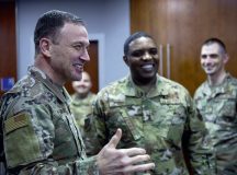Lt. Gen. John D. Lamontagne, U.S. Air Forces in Europe - Air Forces Africa deputy commander, meets Brig. Gen. Otis C. Jones, 86th Airlift Wing commander, team at Ramstein Air Base, Germany, March 22, 2023. Lamontagne toured the 86th Airlift Wing to meet Airmen and learn about their contribution to the mission. (U.S. Air Force photo by Airman 1st Class Kaitlyn Oiler)