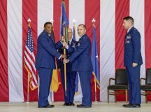 U.S. Air Force Brig. Gen. Otis C. Jones, 86th Airlift Wing commander, left, passes the 86th Operations Group guidon to Col. Bret Echard, 86th OG in-coming commander, middle, during the 86th OG change of command ceremony at Ramstein Air Base, June 15.