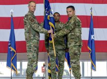 U.S. Air Force Col. Jason Chambers, 406th Air Air Expeditionary Wing commander, right, assumes command of the 406th AEW from Maj. Gen. Derek France, 3rd Air Force commander, left, during a wing activation ceremony at Ramstein Air Base, Germany, June 9, 2023. The activation was part of a larger ceremony including the deactivation of the 435th Air Expeditionary Wing, assumption of command of the 406th AEW and change of command of the 435th Air Ground Operations Wing. (U.S. Air Force Photo by Staff Sgt. Megan M. Beatty)