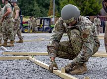 U.S. Air Force Staff Sgt. Michael Anderson, 151st Civil Engineer Squadron electrical power production technician, puts the frame of a tent together during a Silver Flag mission qualification course at Ramstein Air Base, July 24.