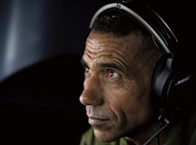 An Algerian air force pilot, assigned to the 2nd Tactical Airlift Wing, looks out the window of a U.S. Air Force C-130J Super Hercules while flying over Germany, Aug. 2. Hosting training operations offers U.S. and Algerian airmen the opportunity to learn and grow from each other’s knowledge of aircraft procedures.