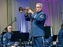Retired U.S. Air Force Master Sgt. Dave Dell, trumpeter, performs a solo at the Kaiserslautern Military Community Christmas Concert in Kaiserslautern, Germany, Dec. 16, 2023. The annual concert has been a tradition for 40 years, and serves as a thank you to the community for their acceptance, hospitality and support of U.S. forces and their families. (U.S. Air Force photo by Senior Airman Madelyn Keech)