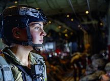 U.S. Air Force Tech. Sgt. Jacklyn Edgmond, 435th Contingency Response Group airborne jumpmaster prepares for an all-female jump out of a C-130J Super Hercules aircraft during Fly Like A Girl event at Ramstein Air Base, Germany, March 20, 2024. Edgmond is team chief over 26 security forces defenders, and is currently the only female jumpmaster with the 435th CRG. (U.S. Air Force photo by Senior Airman Jordan Lazaro)