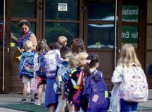 A teacher leads her new class of students to their classroom at Ramstein Air Base, Germany, Aug. 19, 2024. Parents, guardians, and teachers showed support to students as they arrived to their first classes of the school year. (U.S. Air Force photo by Airman 1st Class Dylan Myers)