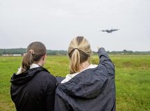 Cheryl O’Keefe and Rebecca Laher, both Massachusetts Institute of Technology research and development engineers, gather data as an aircraft flies overhead during an acoustic sensor demonstration at Ramstein Air Base, Germany, Aug. 1, 2024. The demonstration allowed the sensor to read several different types of aircraft and displayed unique acoustic signatures for each that can be useful for early detection of opposing forces. (U.S. Air Force photo by Airman 1st Class Tabatha Chapman)