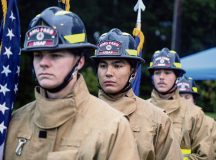 Members of the 86th Civil Engineer Squadron Fire and Emergency Services Flight, stand at attention before presenting the colors at a Sept. 11 remembrance ceremony at Ramstein Air Base, Germany, Sept. 11, 2024. Nearly 200 service members, first responders and civilians participated in the ruck march as a way to remember the sacrifices and heroic actions of those who lost their lives during the Sept. 11 attacks. (U.S. Air Force photo by Senior Airman Thomas Karol)