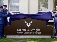 U.S. Air Force Col. Jamil I. Musa, 86th Airlift Wing deputy commander, and U.S. Air Force Chief MSgt. Louis Ludwig, 86th AW command chief, and Retired U.S. Air Force Chief Master Sergeant of the Air Force #18, Kaleth O. Wright, unveil the new Airman Leadership School sign at Kapaun Air Station, Germany, Sept. 19, 2024. The Airman Leadership School was renamed in honor of Wright, who served there as an instructor. (U.S. Air Force Photo by Senior Airman Jared Lovett)