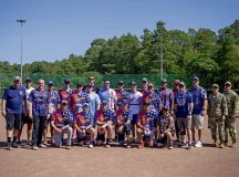 U.S. Air Force Airmen take a group photo after a Chiefs vs. Eagles softball game during the second annual 86th Airlift Wing Sports Day, Aug. 29, Ramstein Air Base. The game was the final event for the wing sports day, where Team Ramstein members built camaraderie through a series of friendly competitions throughout the day. Photo by Airman 1st Class Tabatha Chapman