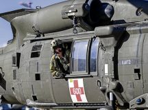 A U.S. Army soldier from 2nd Battalion, 2-227 Aviation Regiment, coordinates with the pilot of a HH-60M Blackhawk for takeoff during Operation Guardian Wings at Ramstein Air Base, Oct. 23. OGW demonstrated the interoperability of Army and U.S. Air Force assets, reducing the time it takes to move patients from the battlefield to higher echelons of care. Photo by Airman 1st Class Dylan Myers