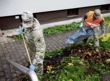 U.S. Army Command Sgt. Maj. Raymond Wrensch, U.S. Army Garrison Rheinland-Pfalz senior enlisted advisor, works alongside a U.S. Airman to clean the outside of base housing at Vogelweh Military Complex, Germany, Nov. 15, 2024. Kaiserslautern Military Community Fall Clean-Up Day was an opportunity to unite the community and build relationships while bettering the cleanliness of KMC installations. (U.S. Air Force photo by Senior Airman Kaitlyn Oiler)