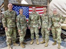 Leadership from Ramstein Air Base pose for a group photo during a visit to Camp Lemonnier, Djibouti, on November 20, 2024. Pictured, from left, are Maj. Alexander Humphrey, Lt. Col. Cortney Zuercher , Maj. Gen. Paul Moga, commander of the Third Air Force, Brig. Gen. Christopher Leonard, Director of Logistics, Engineering and Force Protection of the Third Air Force, and Chief Master Sgt. Stephanie Cates, Command Chief Master Sergeant of the Third Air Force. Their visit underscores the U.S. Air Force's dedication to supporting operations in East Africa. (U.S. Air Force photo by Staff Sgt. Jana Somero)