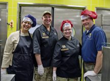 U.S. Air Force Brig. Gen. Adrienne L. Williams, 86th Airlift Wing commander, right, her husband, Rodney, U.S. Air Force Chief Master Sgt. Louis J. Ludwig, 86th Airlift Wing command chief, left, and his wife, Christi, pose for a photo in the Rheinland Inn Dining Facility during the Thanksgiving luncheon at Ramstein Air Base, Germany, November 28, 2024. Leaders from around the DoD served Thanksgiving meals to the Kaiserslautern Military Community to show their appreciation during the holiday season. (U.S. Air Force photo by Tech. Sgt. Miquel Jordan)