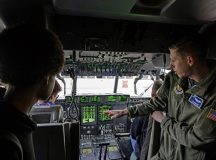 U.S. Air Force Capt. Tyler Martin, right, 37th Airlift Squadron C-130J Super Hercules pilot, gives a tour of a C-130J flight deck to Kaiserslautern Middle School students at Ramstein Air Base, Germany, Jan. 15, 2024. The students are members of the Advancement via Individual Determination program.During the tour, they received first-hand information about the C-130J, giving the students a chance to learn about the capabilities of the Air Force. (U.S. Air Force photo by Airman 1st Class Trevor Calvert)