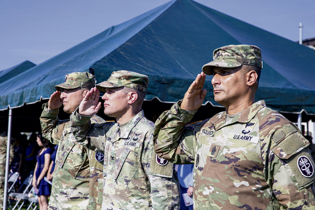 U.S. Soldiers with the Landstuhl Regional Medical Center render honors during a change of responsibility ceremony, Aug. 29. 2024 at Landstuhl, Germany. Command Sgt. Maj. Jorge L. Oquendo assumed responsibility of the unit from Command Sgt. Maj. Omar A. Mascarenas. (DoD Photo by Travis Jones)